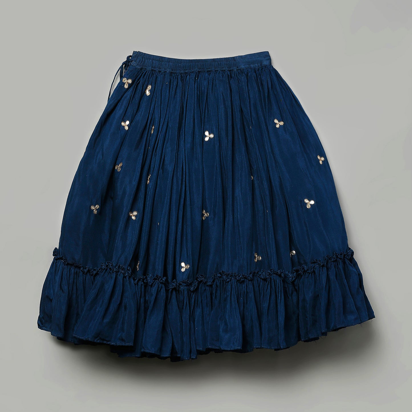 Hand embroidered lehenga and pleated blouse set with shell enhanced tassels