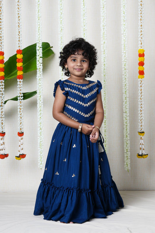 Hand embroidered lehenga and pleated blouse set with shell  enhanced tassels