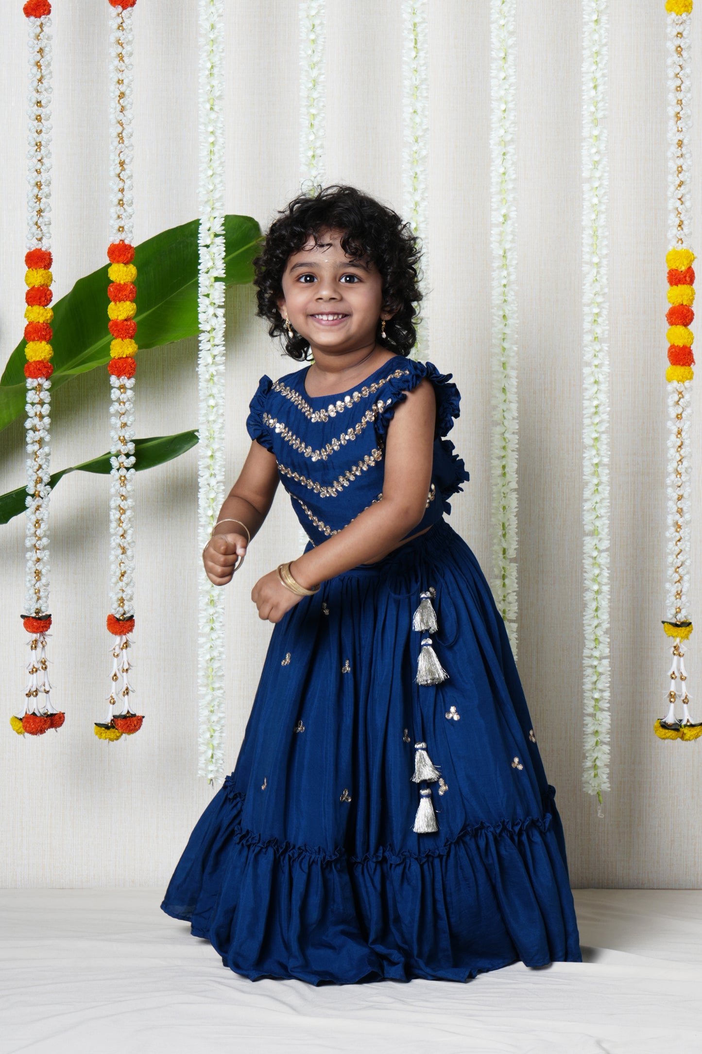 Hand embroidered lehenga and pleated blouse set with shell  enhanced tassels