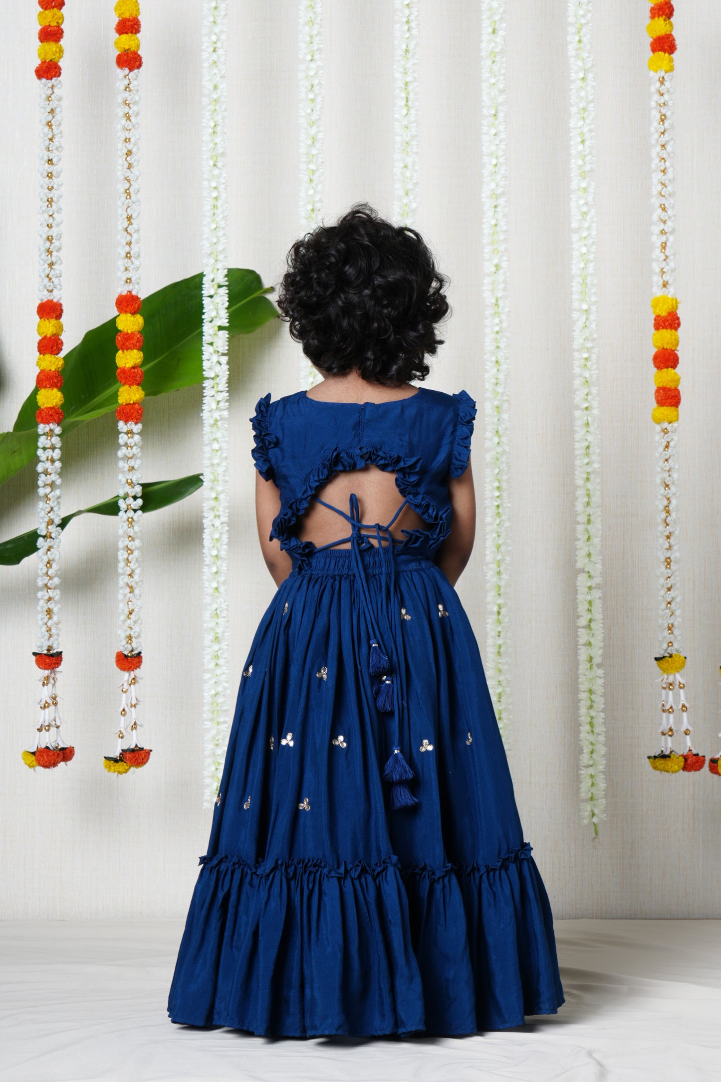 Hand embroidered lehenga and pleated blouse set with shell  enhanced tassels